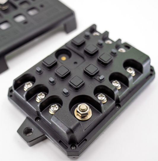 Shows the DMD Power Box with the internal connection terminals.