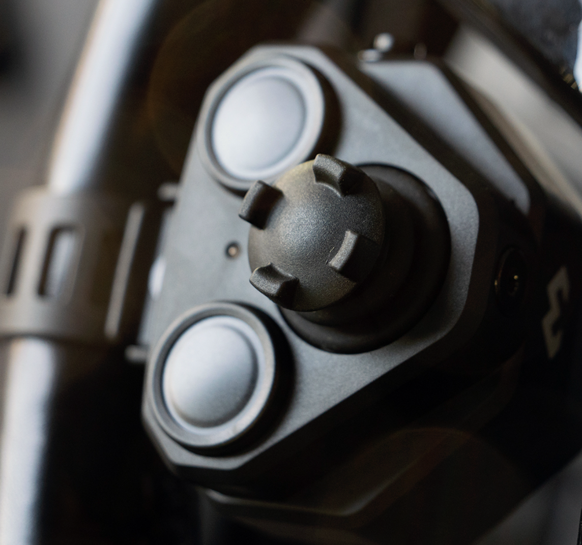 Shows DMD Remote for overlander and 4x4 vehicles mounted on steering wheel