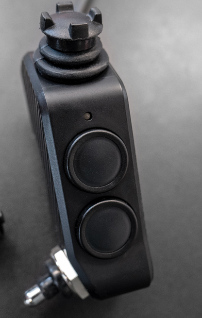 Shows DMD Remote front side with 360° Joystick two buttons and switch