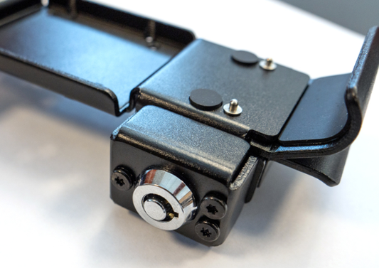 Shows a detail view of the DMD-T865X with the lock on the side of the holder 